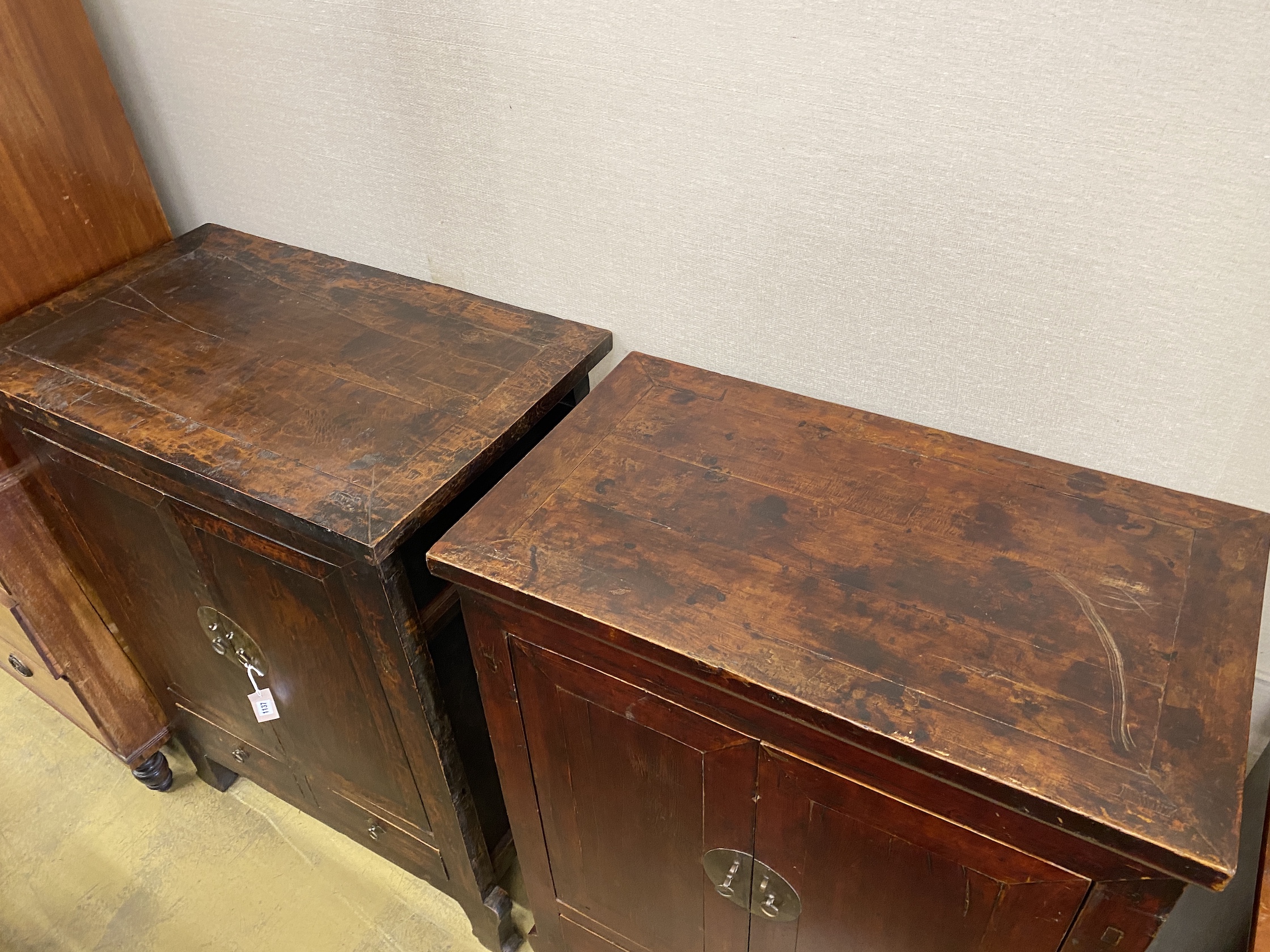 A near pair of Chinese hardwood lacquer side cabinets, larger width 91cm, depth 55cm, height 117cm